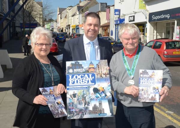 Glyn Roberts, Chief Executive of the Northern Ireland Independent Retail Trade Association, pictured with Mariann Casagrande and John Shannon (Chairman) of the Larne Traders' Forum launching the Local First campaign in Larne. INLT 17-369-PR
