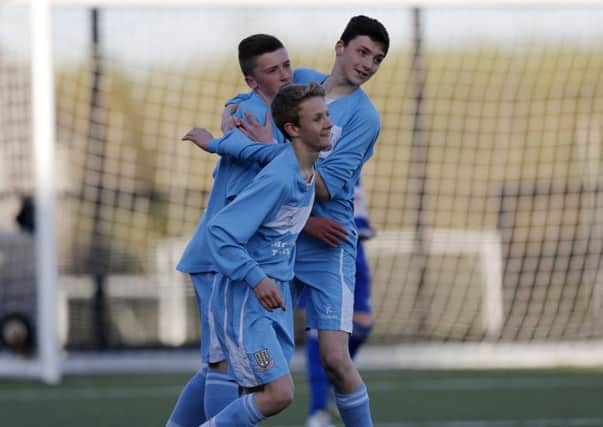 Ballymena United U15's Michael McCabe is congratulated by his team mates after he scored his team's second goal in last week's league win over Nortend. INBT 17-171CS