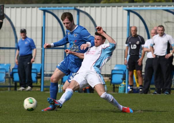 Ballymena United defender Mark McCullagh challenges Ballinamallard's Richard Lecky during today's game at Ferney Park. Picture: Press Eye.