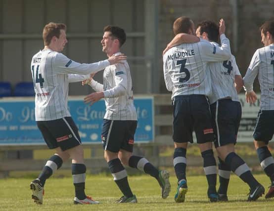 Gareth Tommons leads the celebrations after his goal put Coleraine in front against Warrenpoint Twon. PICTURE: Derek Simpson