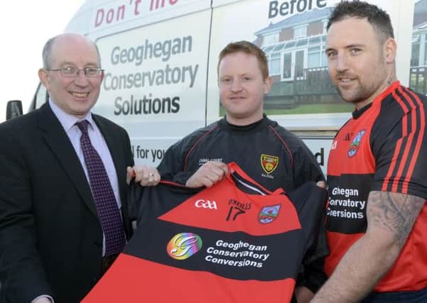 On behalf of Geoghegan Conservatory Solutions Des Connolly presented new jerseys to Clan Na Banna Chairman Seamus Ryan and Captain Paddy Feeney © Edward Byrne Photography INBL16-206EB