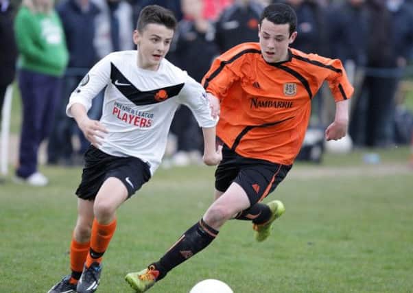 Youth soccer action from the under-14 semi-final between Lisburn Youth (playing in white shirts) and Carrick, at Ballymacoss. US1416-540cd Picture: Cliff Donaldson