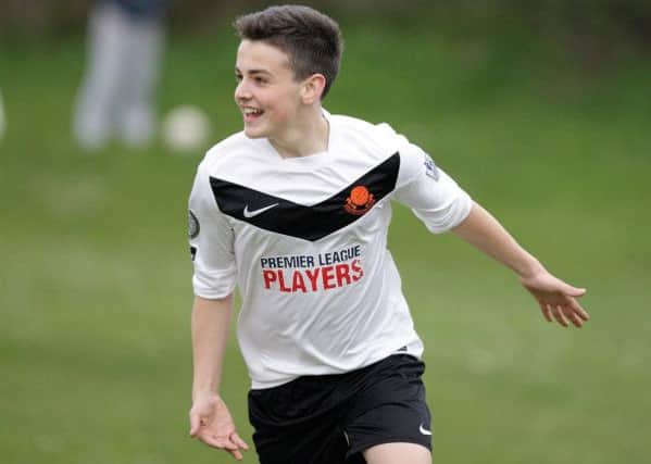 Lisburn Youth's Ross Hull celebrates after scoring against Carrick in the under-14 semi-final at Ballymacoss. US1416-542cd Picture: Cliff Donaldson