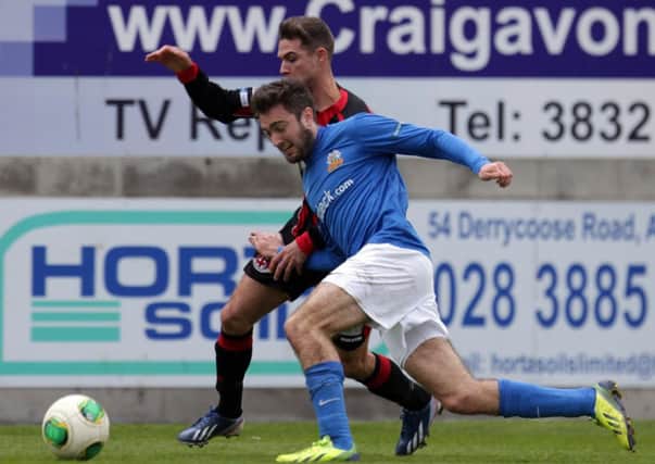 Glenavon's Mark Patton in action with Crusaders David McMaster.