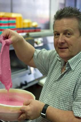 THERE'S SOMETHING FISHY GOING ON.. Pictured with his 'pink battered fish' for the Giro is Geoffrey McKillop, owner of the Hip Chip Bushmills.INBM10-14 001SC. PIC BY HANNAH FRIZZELL.