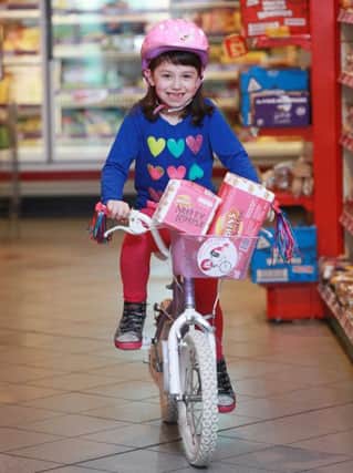Clodagh Wilson (7) with her special Giro Pink Nutty Krust and Softee loaves.