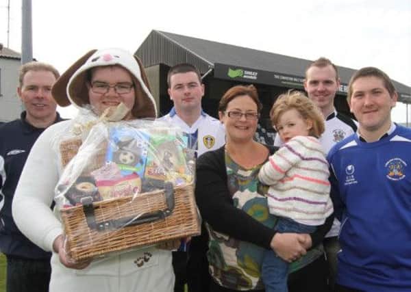 Nicola Jamison was the winner of the New City Whites' Easter Chocolate Hamper draw. She and her daughter were presented with her hamper by members of the New City Whites and their Easter Bunny. Picture - David Hunter.