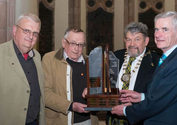 Dave Crewes, President of the Pan Celtic Festival and Cornish Delegate, (second from right) has welcomed recognition of the Cornish people as an official minority. 
Also pictured (from left) are Arwel Roberts and Tegwyn Williams from Wales presenting a new Harp Competition Trophy to Mr Crewes, and Con O Conaill, Chairperson of the International Committe in Londonderry's Guildhall, as part of the 43rd International Pan Celtic Festival which continues until Sunday (April 27), 
The trophy was presented in memory of Robin James Jones.