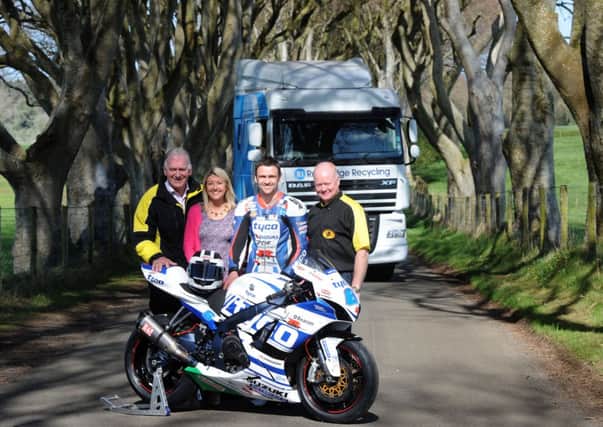 For Armoy Road Races and RiverRidge Recycling third times the charm as Tyco Suzukis William Dunlop is pictured with Clerk of the Course, Bill Kennedy, Pamela Jordan, Business Development Manager, RiverRidge Recycling and William Munnis Chairman of the AMRRC at the renowned Dark Hedges near Armoy. Picture by Stephen Davison, Pacemaker Press International.