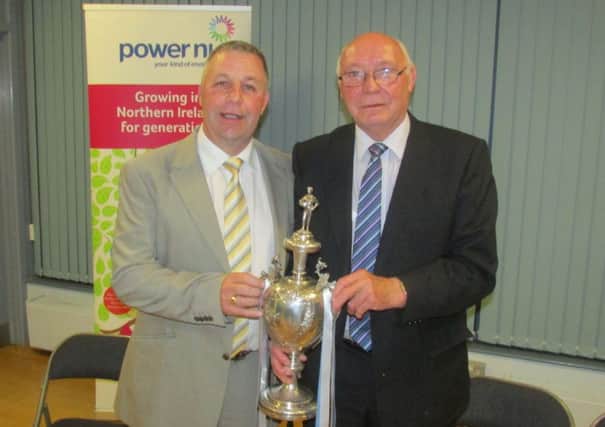 Paul Hardy and Alex McKee pictured with the old Irish Cup trophy at the 25th anniversary reunion dinner on Saturday night.