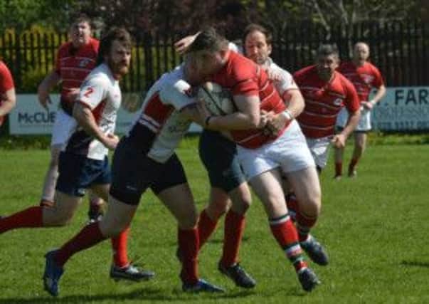 Action from Larne III's Butler Shield defeat to Malone IV. Photo: Bill Guiller