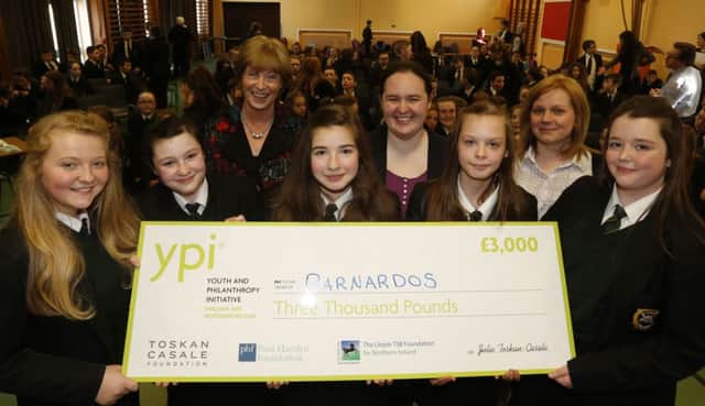 St Patrick's College students who were the winning team in the YPI (Youth and Philanthropy Initiative) competition are seen here with a cheque for £3000 which goes to their chosen charity Barnardos. L-R, Megan Harrison, Kerry McDonnell, Natalia Borris, Iona Fijalkowska and Katie Black with school principal Mrs Magee, Lauren Lamberton (YPI) and teacher Miss Dowrzycz. INBT 17-104JC