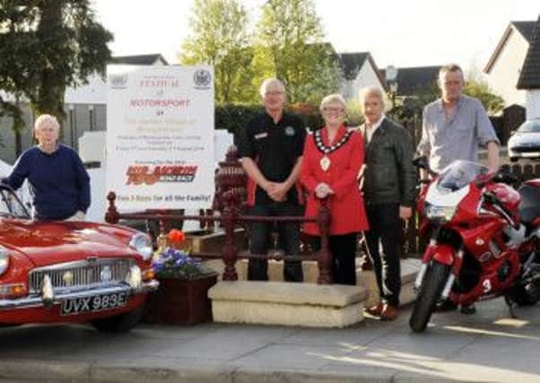 Ballymena Mayor Audrey Wales joins Jack Agnew President MCUI and Section member along with Sandy Wilson Broughshane and District Community Association, Adrian McDowell Chairman Clough Community Association, Harold Crooks Vintage Cars at the launch of the Festival of Motorsport in the Garden Village of Broughshane.