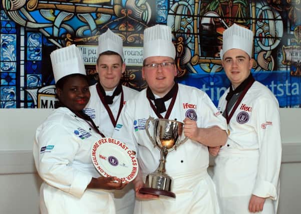 Belfast Met student, Stuart McCully, from Larne, has won the gold award for the coveted Parade des Chefs competition at IFEX 2014. Stuart (right) is pictured with his fellow winners and classmates, Abi Ajetunmobi and Declan Ryan and Belfast Met hospitality lecturer, Thomas Turley. Pic by Press Eye. INLT 18-651-CON
