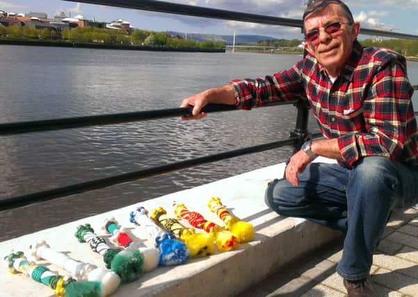 Malcolm Doherty displaying some of his hand crafted bell ropes by the River Foyle, once a bustling locus of merchant shipping.