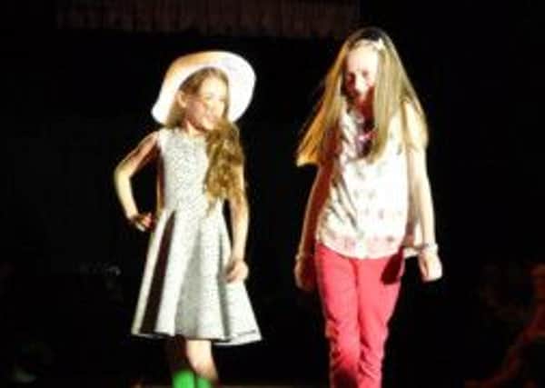 Pupils modelling at the fashion show.