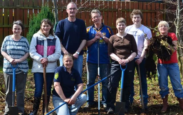 Taking part in the community garden project are (from left)  Ann ODonnell, Sandra Cass, Mary Hamilton, Stephen McGowan, Jim Kitchen, Jeni McAughey, Eoin McAughey and MaryAnn McReynolds. INCT 18-701-CON