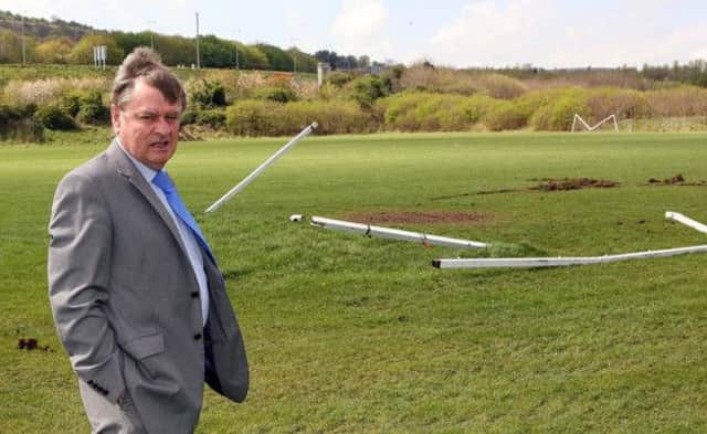Mayor Fraser Agnew checks out the damage caused to the sports pitches at the Valley Park on Easter Monday. INNT 18-003-FP