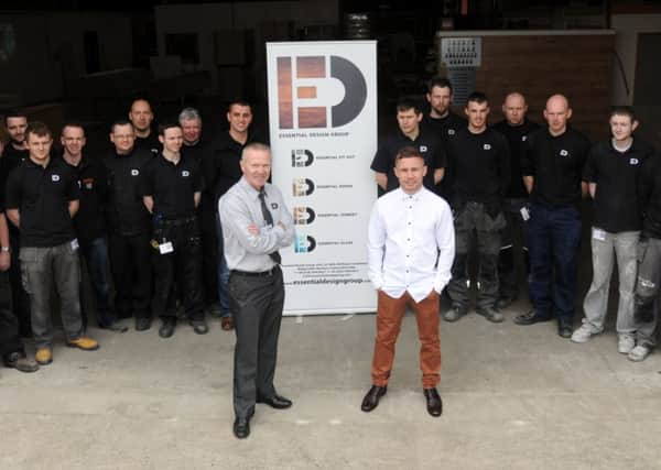 Oliver Higgins Proprietor of the Essential Design Group with Boxer Carl Frampton and staff members.INMM1814-345