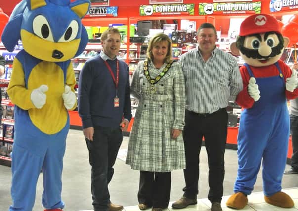 Stuart Dixon, Deputy Mayor Dineen Walker and Trevor Finlay with Sonic and Mario at the opening of the new CeX store in Abbeycentre. INNT 19-502CON