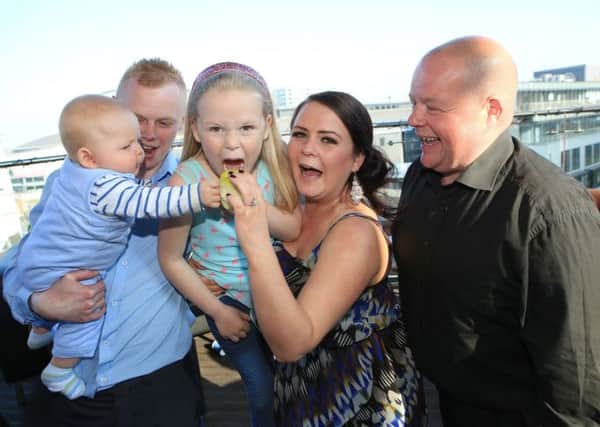 Northern Ireland's Yummy Mummy of the Year, 23 year old Lynsey Gilkinson pictured with her family, partner Jason Williamson, son Carter, 11 months, daughter Kelsie and father Andy. Lynsey was chosen as a finalist for The Sunday World competition and won a trip for two to the Big Apple courtesy of US and cruise specialists American Holidays. She also walked away with a goodie bag of US brand Senna Cosmetics products generously donated by Oonagh Boman Makeup, the Irish and UK distributor for the brand.