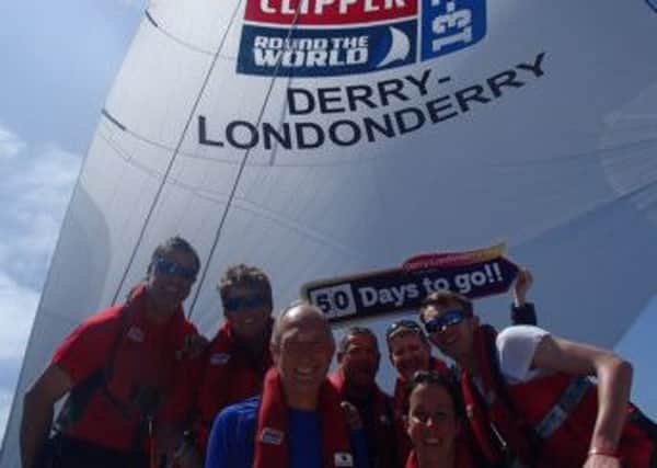 Members of the Derry-Londonderry celebrate the countdown to home surf...
