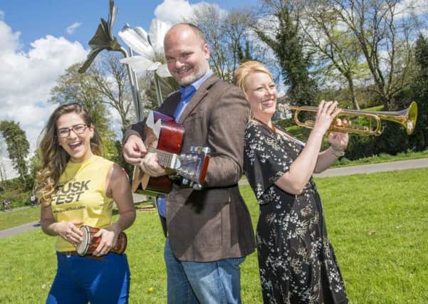 Banbridge District Council's Nicola Armstrong (right) joins Emma Curran and Ralph McLean (BuskFest judge) to launch BuskFest 2014, which takes place in Banbridge on Saturday 21 June with a £3,000 prize pot. Buskers can register now at www.buskfest.com .