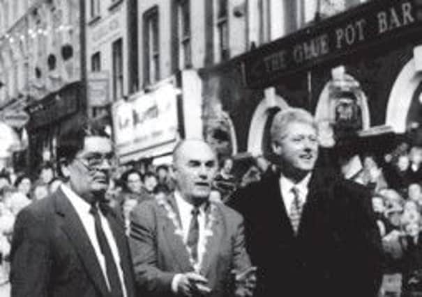 John Hume, John Kerr and Bill Clinton on his first ever visit to Londonderry in 1995. According to newly-released US documents, Mr Clinton was encouraged not to visit the city in 1998.