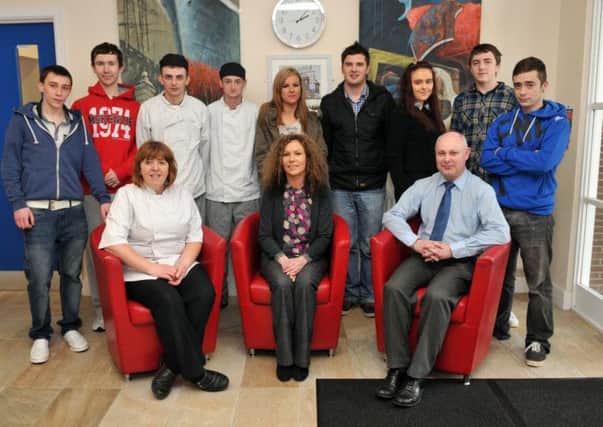 Wade Training tutors, from from left, Mary Breen, Jacqueline McKeown and Neil Hoey with , retail, catering and business administration students who have reached the final of the Money for Life Challange. INLM13-101gc
