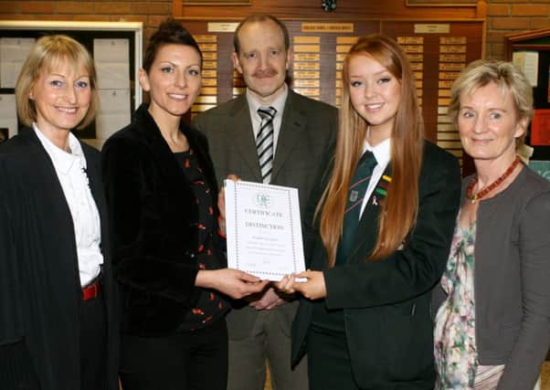 Cambridge House student Kimberely Glass is pictured receiving a certificate of distinction, from the Association for Art and Design Education NI, for outstanding work in her GCSE art exams from Michelle McElhone (AADE). Included are Mrs. Elma Lutton (Principal), Mr. John Maybin (Head of Art) and Mrs. Deirdre Neill (AADE). INBT19-213AC