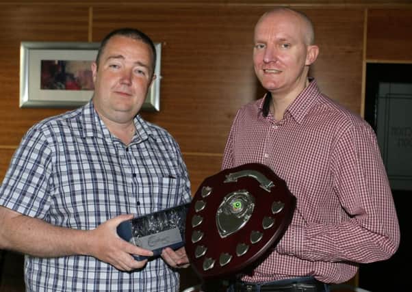 Drew Sloan is pictured receiving the League Individual and the Charity Shield from Gary Richardson at the Ballymena Towers Pool League annual dinner. INBT19-219AC