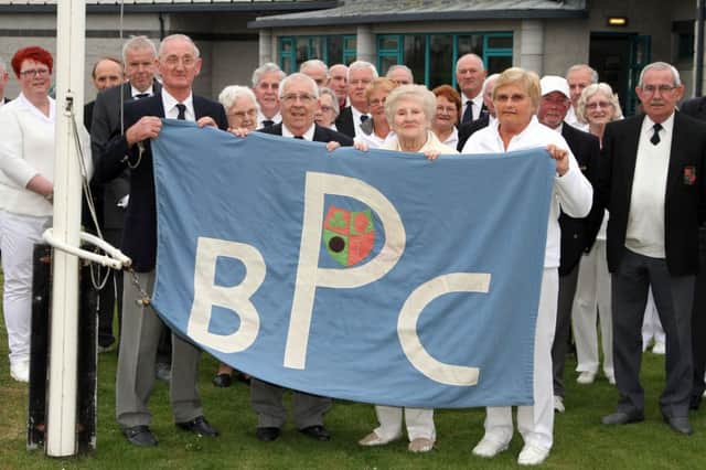 Hugh Hamill, out-going president, Marcus Hemphill, president, Nessa Allen, lady president, and Noelle Conkey, out-going lady president, raise the club flag at the opening of the new season at Portstewart Bowling Club last Monday. INCR19 PORTS 1