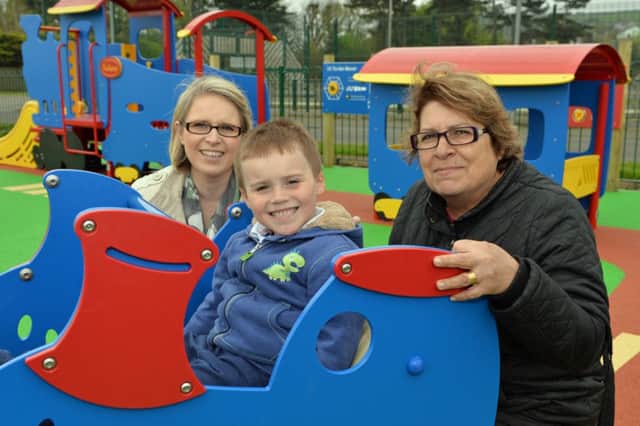 Enjoying the new play park at Castleview Road Whitehead are Sharon,Jacob and Maria Kaprigiannis. INCT 19-019-PSB