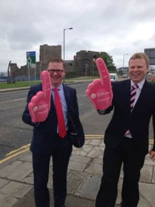 Finance Minister Simon Hamilton (left) and East Antrim MLA Alastair Ross in Carrickfergus to countdown the  'Grande Partenza' of the Giro d'Italia coming to Northern Ireland. INCT 19-797-CON