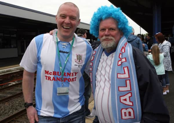 Andy McQuilken, who organised the special train for the Ballymena United fans, is pictured Wesley Reynolds on the platform. INBT19-244AC