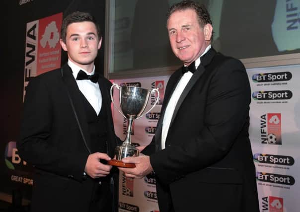 Institute's Michael McCrudden receiving his BT Sport Championship One Player of the Year award from Northern Ireland legend Gerry Armstrong. Darren Kidd/Presseye.com