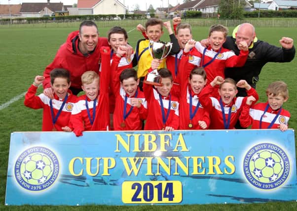 Oxford Sunnyside, celebrate winning the NIBFA Under 11 Knock Out Cup.