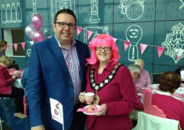 Mayor Audrey Wales MBE enjoying a cup of Pink Tea at the Mayor's Pink Tea Party with Rodney Kernohan.