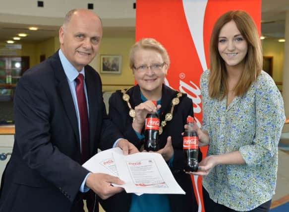 (l-r) Mr Jim Rose, Director of the Council's Leisure Services Department; the Mayor of Lisburn, Councillor Margaret Tolerton and Miss Nicci Gregg, Community Development Manager, Coca-Cola HBC Northern Ireland.