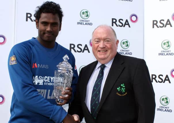 Sri Lanka captain Angelo Matthews receives the RSA Insurance ODI Series trophy from Cricket Ireland President Joe Doherty.
