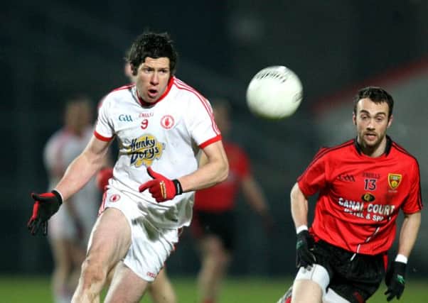 Sean Cavanagh of Tyrone and Conor Laverty of Down