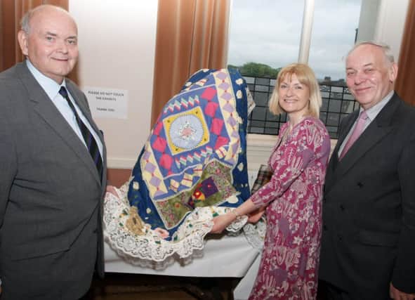PIECE OF WORK. Pictured at the launch of the Creative Ballymoney Exhibition in Ballymoney Town Hall on Thursday night are Alex Blair, Magaret Edgar and Mac Pollock from Ballymoney Borough Arts Committee.INBM20-14 055SC.