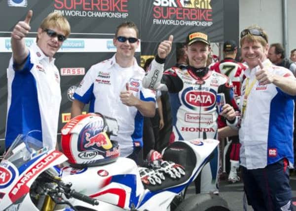 Jonathan Rea (second from left) celebrates his double win at Imola with members of his Pata Honda team.