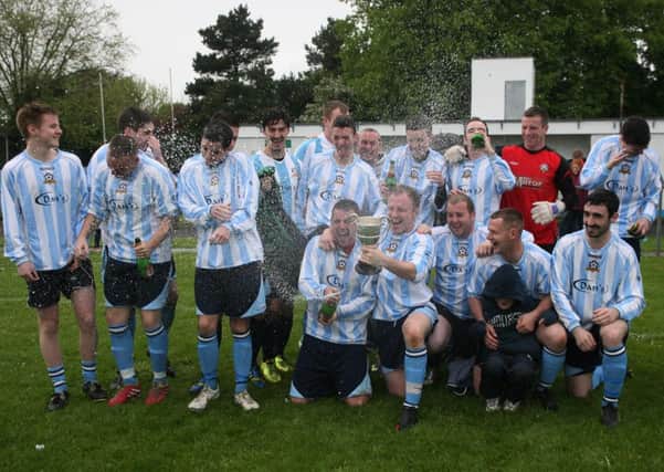 CHAMPAGNE CELEBRATION!. . . .It's bubbly all round for Claudy Rovers players as they celebrate their North West City Cup victory over Ardmore on Saturday night's final.  INLS1914MC065