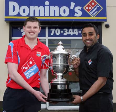 Jordan Dallas of Coleraine Bowling Club pictured with club sponsor Joggy Dhillon of Domino's Pizza Coleraine and the Irish Bowling Association Cup the team won. INCR20-138PL
