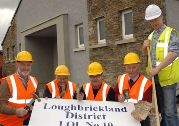 District officers of Loughbrickland No.10 District including from left, Bro. Keith Murdoch, District Secretary, Bro. Jim McClelland, Bro. Alan Rogers, Deputy District Master,Worshipful Bro. Mark Eillott and Raymond Fegan, main building contractor d7 Property Services, add the finishing touches to the new district Orange Hall, which officially opens on Tuesday 8th July 2014.  © Photo: Gary Gardiner. IN BL WK 2014-501.