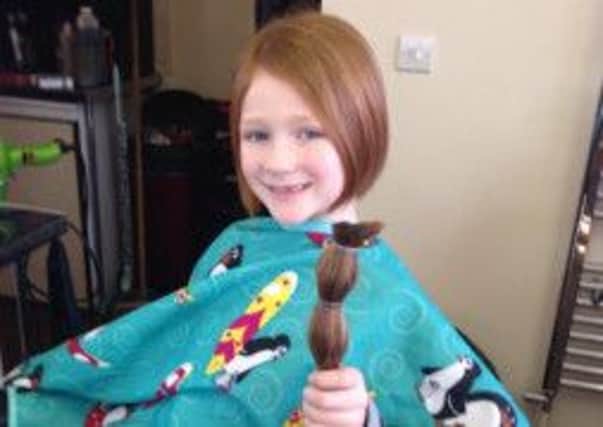 Ellie Johnston (aged seven) who got 14 inches of her pony tail cut off for the Rapunzel Hair Foundation (for children's wigs). The Tandragee Primary School pupil had her hair cut by her aunt Kim Topley of KT Hair. Kim said: "Ellie had wanted her hair cut for a good while, but her mum wasn't keen. I told her about Rapunzel Hair Foundation and she did a bit of research then her mum agreed she could get it done if it was for a good cause. She actually had to grow it for four or five months so it was long enough to give a 14 inch pony tail. Her friend Katlin Rock got her hair cut the following week. Now Ellie is thinking of doing it again."