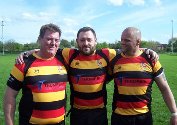 Captain Andy Mackey with his substantial front row and past players Raymond Acheson and Graham Currie.