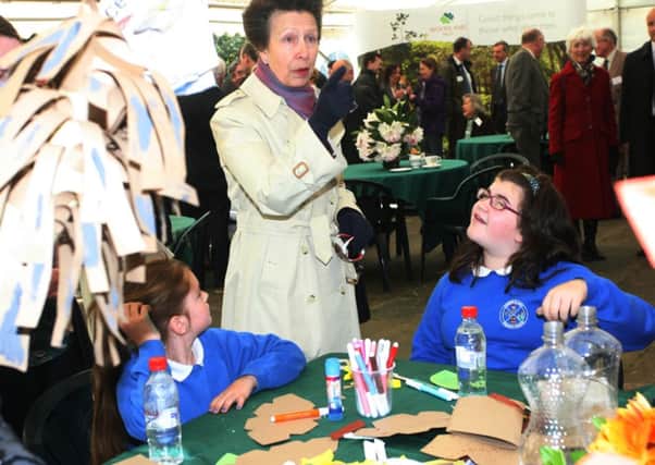 HRH Princess Royal chats with Cumber PS, Claudy pupils Katie Armstrong and Sophie Temple about the models they made during yesterday's visit to Faughan Valley. INLS2014MC034