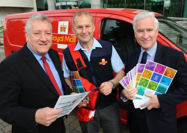 Councillor Pat Catney, Chairman of the Council's Corporate Services Committee; Sean Taylor, Royal Mail and Adrian Donaldson, Director of Corporate Services begin the delivery of the Council's Annual Report to all homes within the Lisburn City areas.